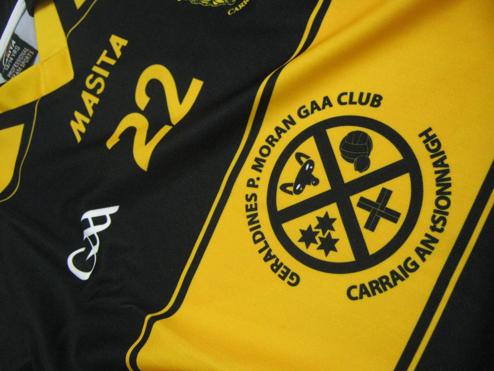 Geraldines P. Moran GAA Club crest on a yellow and black jersey