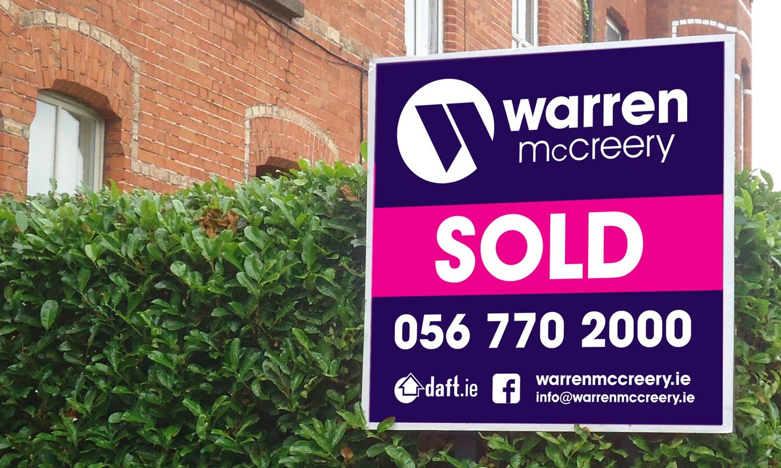 Warren McCreery Sold board on a red-brick terrace